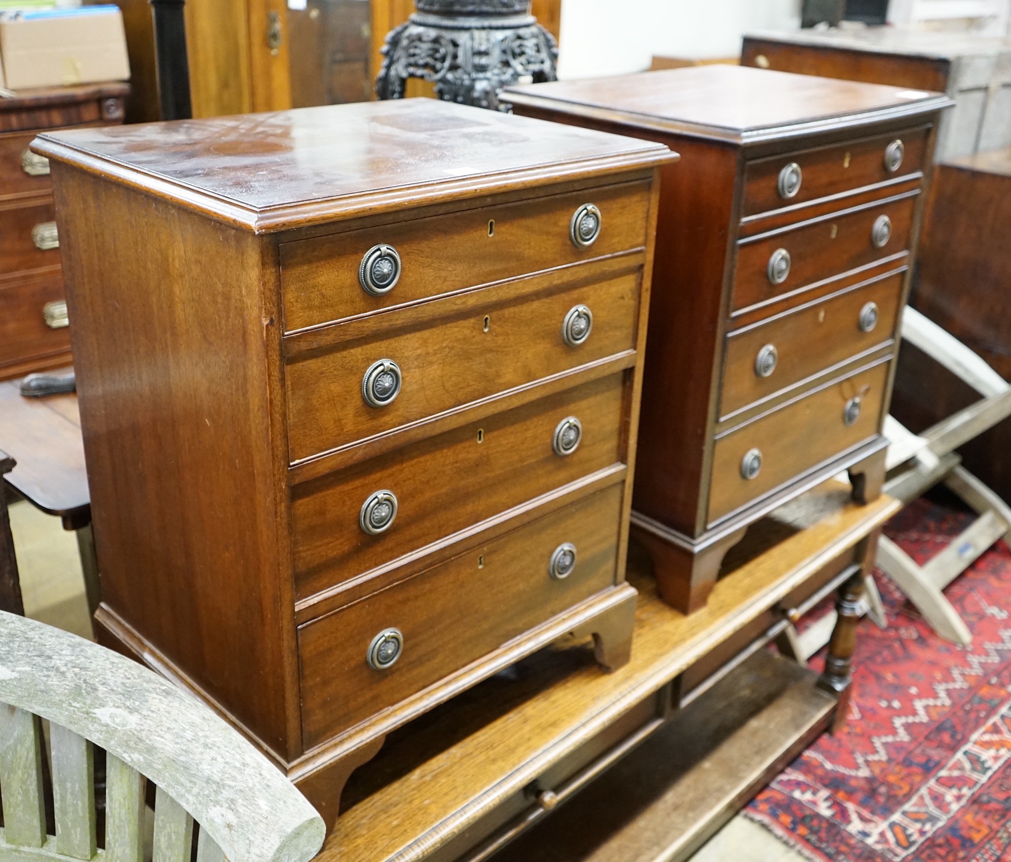 A pair of reproduction George III style mahogany bedside chests, width 56cm, depth 43cm, height 70cm